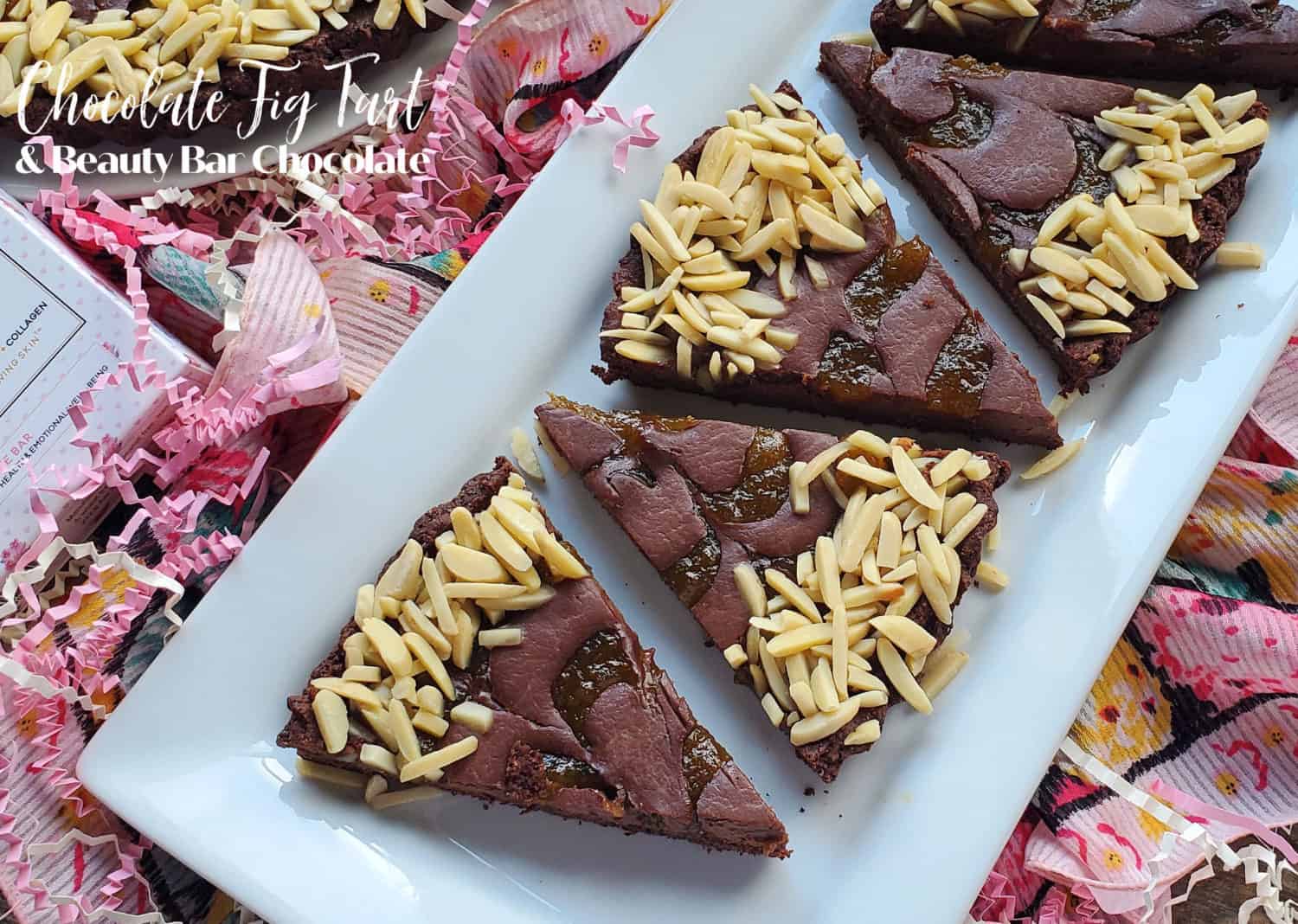 Chocolate Fig Tart: Coconut chocolate ganache & fig jam in an Almond Cocoa Crust & loads of slivered almonds. Fruity, chocolatey & nutty. Vegan never tasted so sinfully delicious!