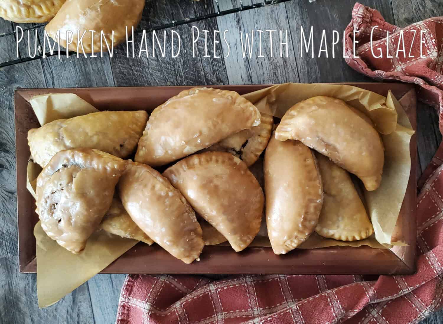 Spiced pumpkin pie filling baked in a buttery flaky crust, and maple glaze for a tasty hand-held dessert; autumn never tasted so good.